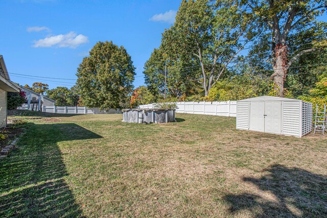 view of yard featuring a storage unit