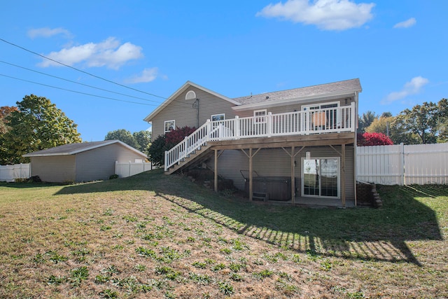 back of house with a yard and a wooden deck