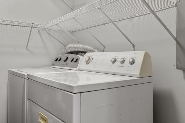 clothes washing area with independent washer and dryer