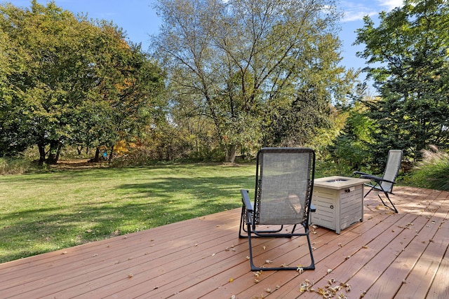 wooden terrace with a lawn