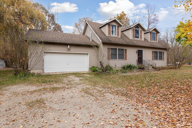 new england style home with a garage