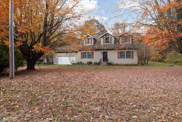 new england style home with a garage