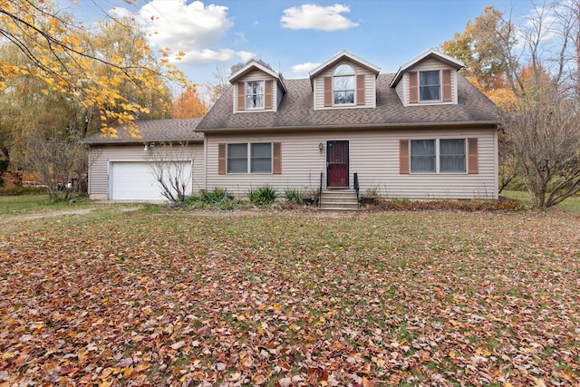 cape cod-style house with a garage