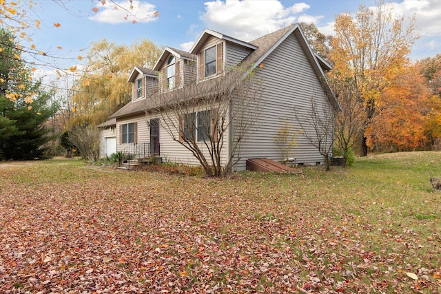 view of property exterior with a lawn