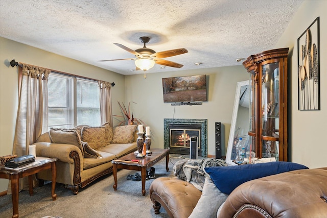 living room featuring light carpet, a textured ceiling, and ceiling fan