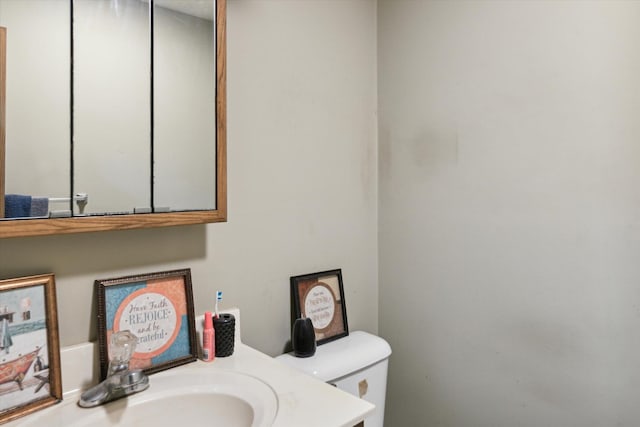 bathroom featuring toilet and sink