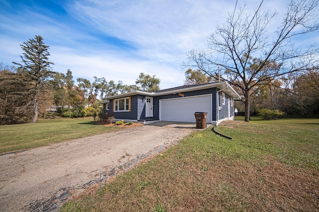 ranch-style house with a garage and a front lawn