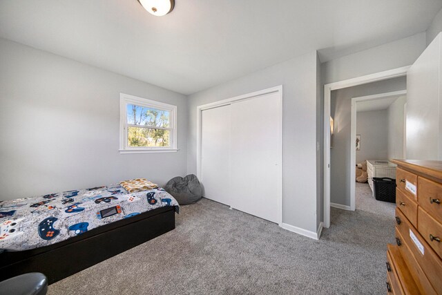 carpeted bedroom featuring a closet