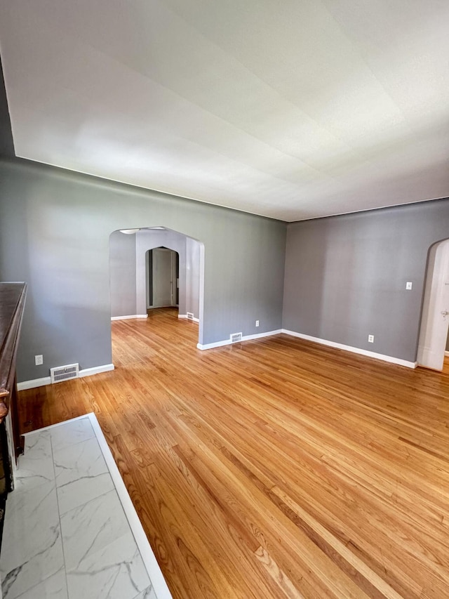 unfurnished living room with light hardwood / wood-style floors