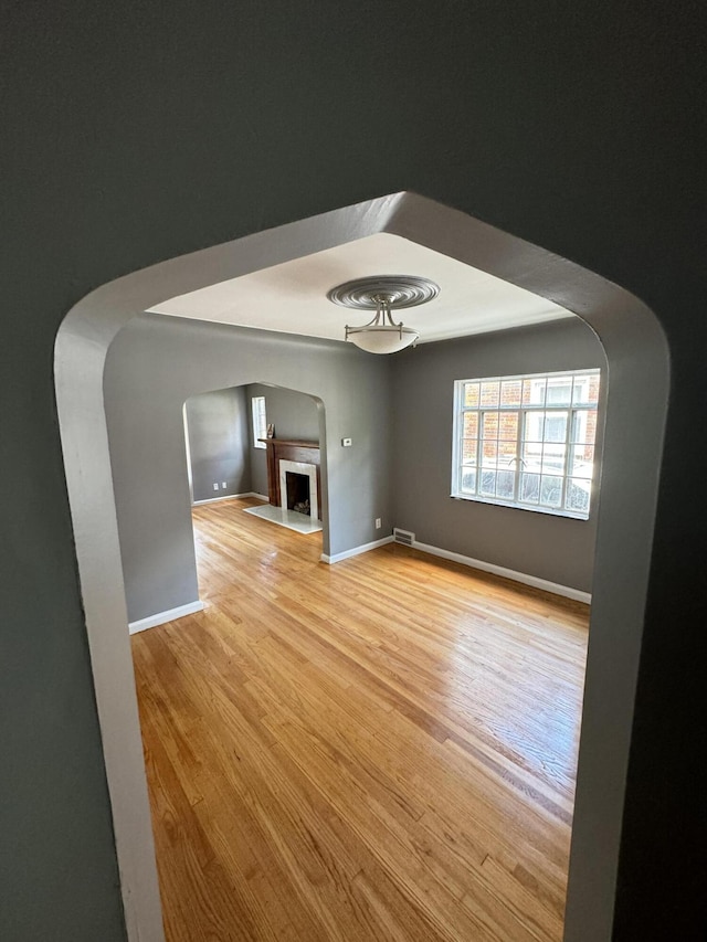 unfurnished living room with light hardwood / wood-style floors