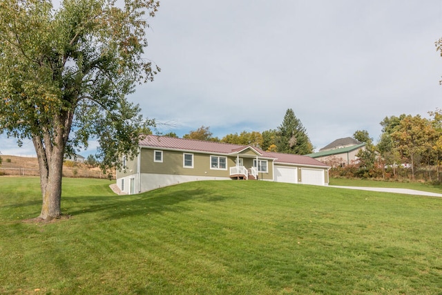 ranch-style home with a front lawn and a garage