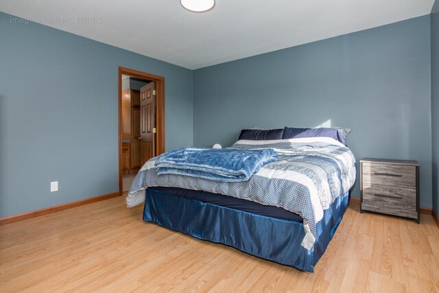 bedroom featuring hardwood / wood-style flooring