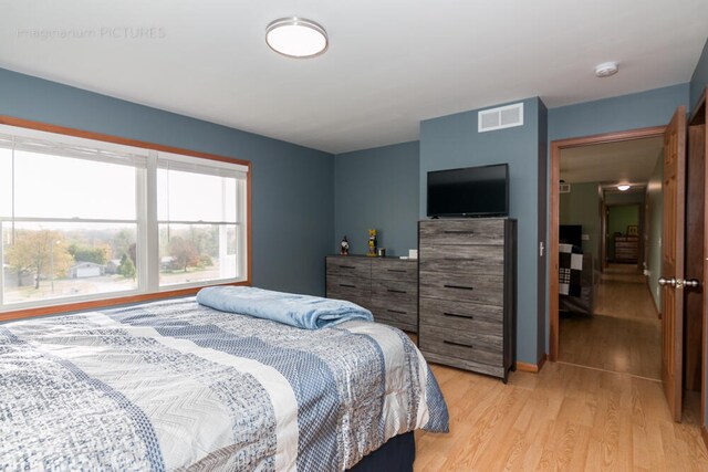 bedroom with light hardwood / wood-style floors