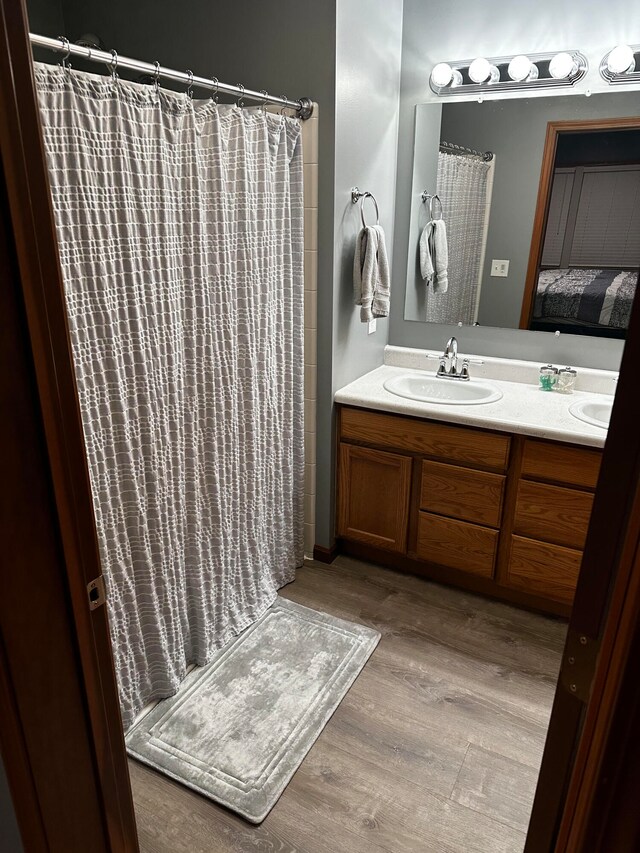 bathroom featuring vanity and wood-type flooring