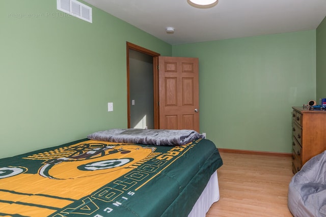 bedroom with light hardwood / wood-style flooring