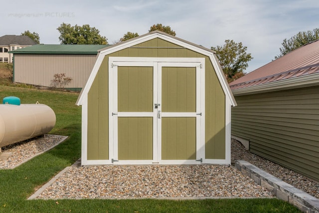 view of outbuilding with a lawn