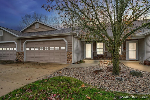 ranch-style house featuring a garage