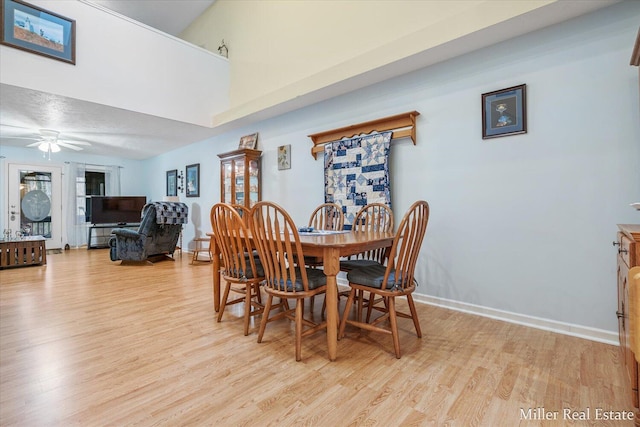 dining room featuring light wood-type flooring and ceiling fan