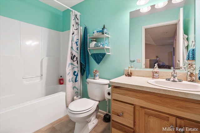 full bathroom featuring shower / bath combo, vanity, and toilet