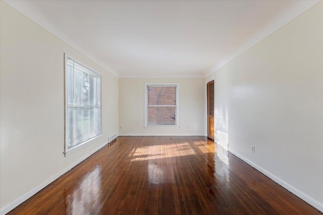 spare room with hardwood / wood-style flooring