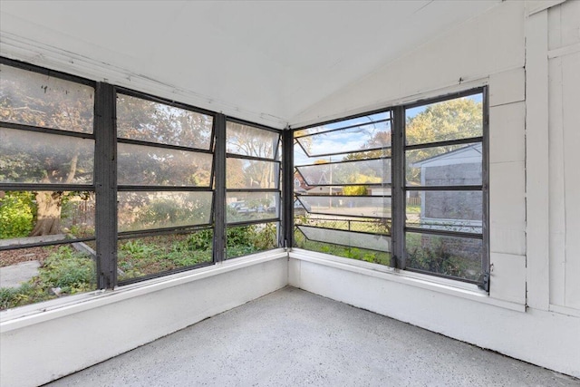 unfurnished sunroom with a wealth of natural light and vaulted ceiling