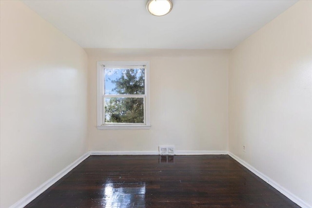 spare room featuring hardwood / wood-style flooring