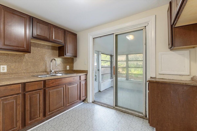 kitchen with tasteful backsplash and sink