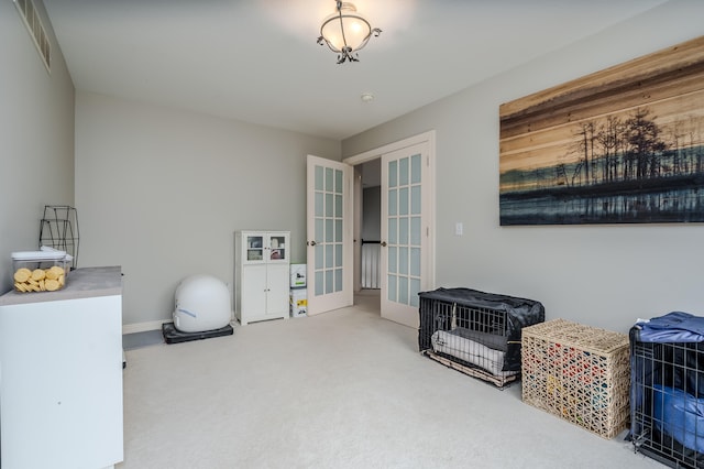 miscellaneous room with french doors and carpet flooring