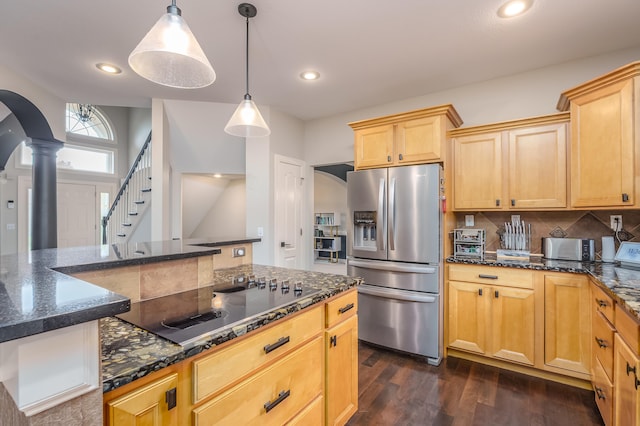 kitchen featuring black electric stovetop, decorative columns, stainless steel fridge with ice dispenser, pendant lighting, and dark hardwood / wood-style flooring