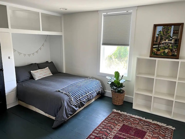 bedroom featuring dark hardwood / wood-style floors