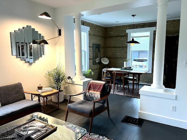 interior space featuring brick wall and dark hardwood / wood-style flooring