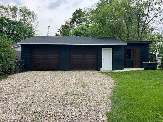 garage with a lawn