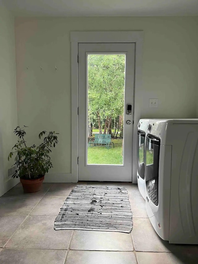 entryway with washer and dryer