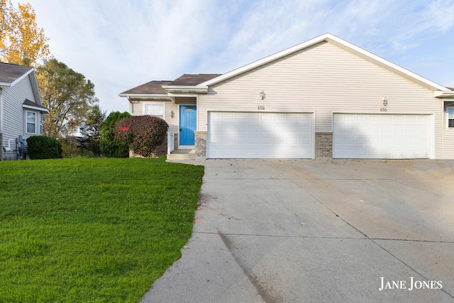 single story home with a front yard and a garage