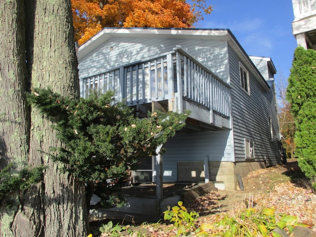 view of side of property with a balcony