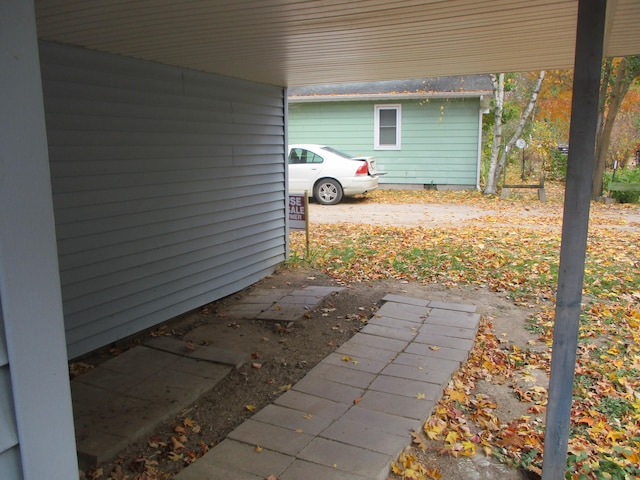 view of patio / terrace with a carport