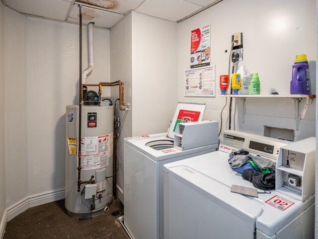 washroom featuring gas water heater and washing machine and clothes dryer