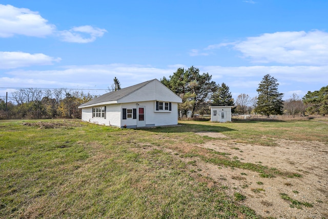 view of home's exterior featuring a yard and a shed