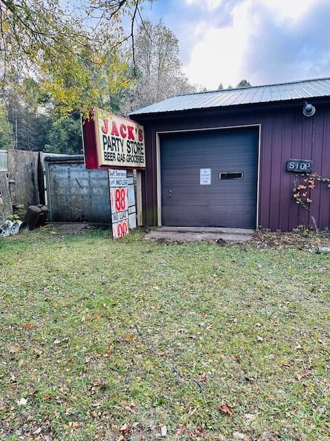 garage featuring a yard