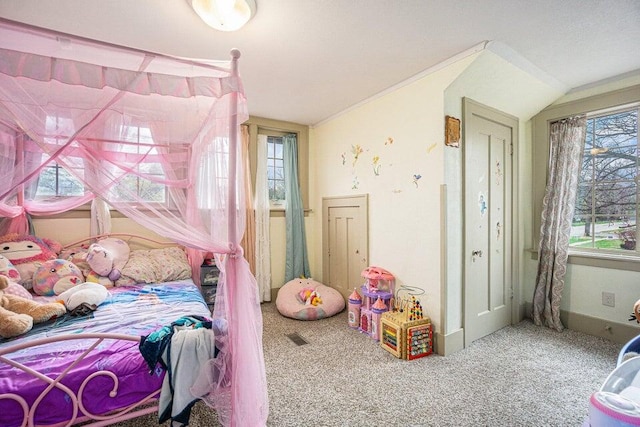 bedroom with vaulted ceiling and carpet floors