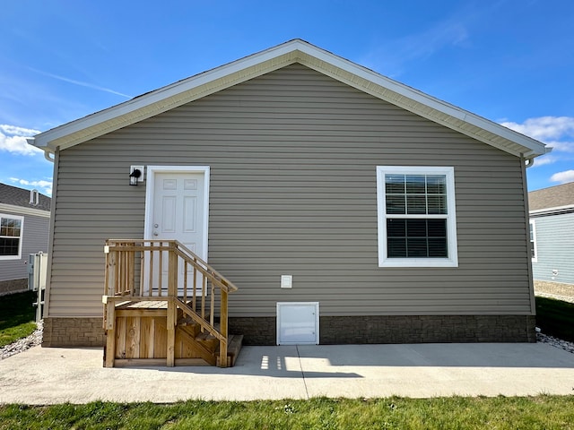 back of property featuring a patio