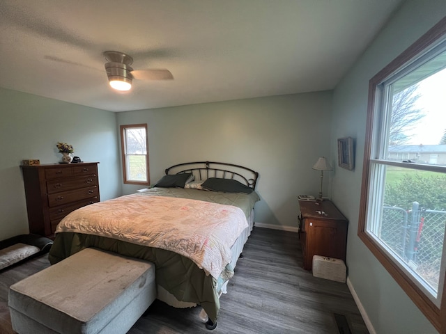 bedroom with dark wood-type flooring and ceiling fan