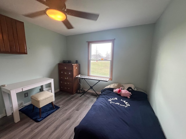 bedroom featuring light wood-type flooring and ceiling fan