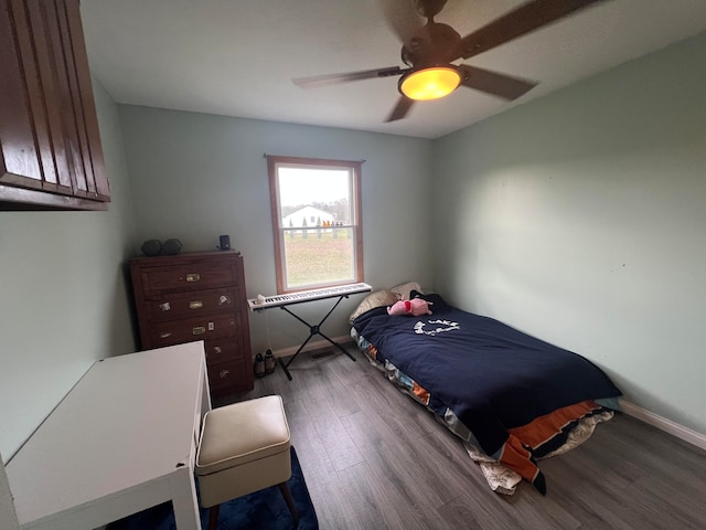 bedroom featuring dark wood-type flooring and ceiling fan