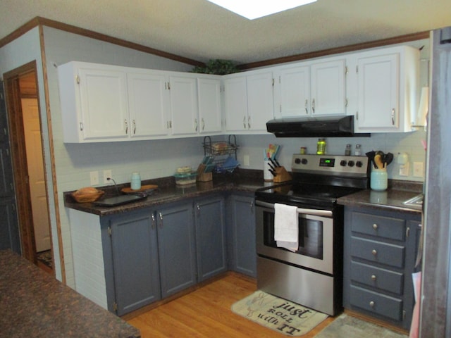 kitchen featuring light hardwood / wood-style flooring, vaulted ceiling, stainless steel range with electric stovetop, gray cabinets, and white cabinets