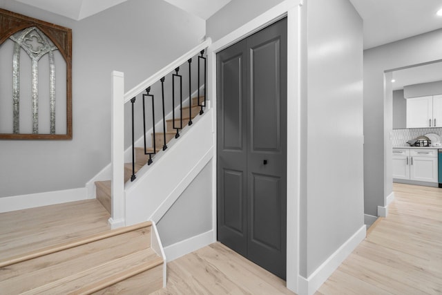 stairway featuring hardwood / wood-style floors