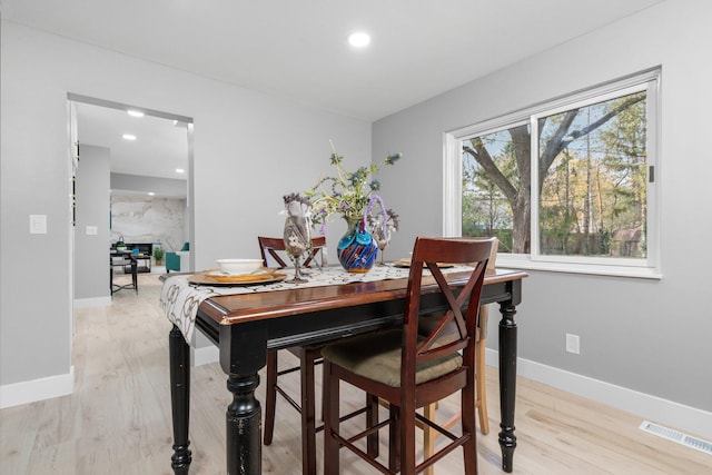 dining space featuring light wood-type flooring