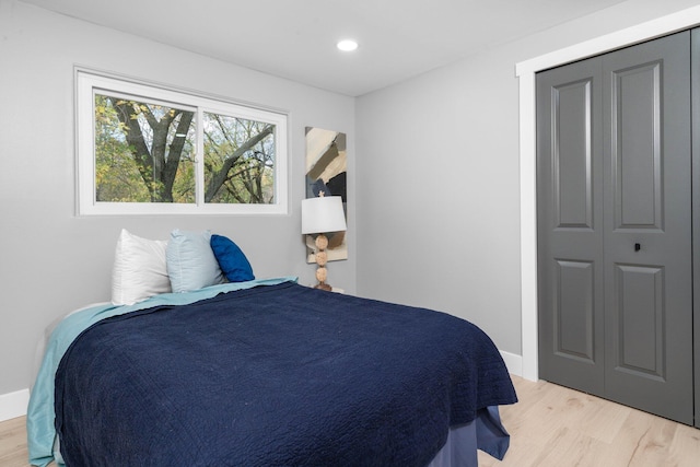 bedroom with a closet and light wood-type flooring