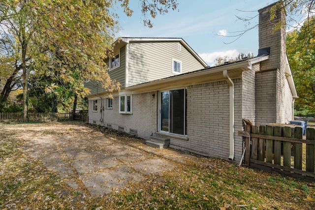 rear view of house featuring a patio