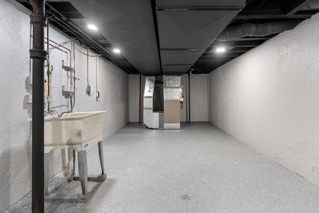 basement featuring heating unit